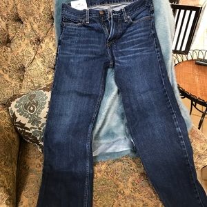 Hollister Young Men’s dark denim jeans.